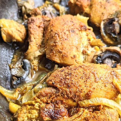 chicken with turmeric and black pepper and mushrooms and onions in a cast iron skillet keto and low carb chicken dinners