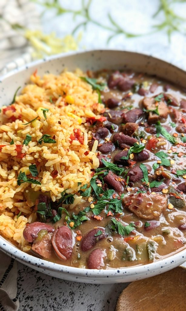 modern beans and rice in a bowl with yellow herbed turmeric rice and kidney beans with grilled sausage