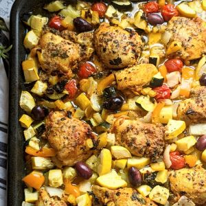 one pan chicken dinner recipe easy oven baked chicken thighs and vegetables low carb gluten free and whole ingredients