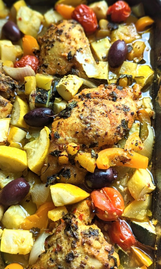 oven chicken thighs with mediterranean vegetables like onions peppers squash and oregano with a light and flavorful dressing for chicken keto low carb gluten free and whole30 friendly chicken recipes