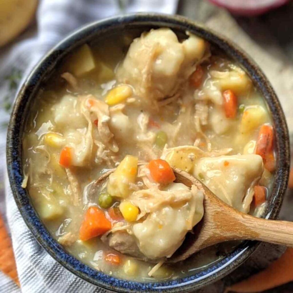 thick chicken and dumplings recipe in a pot easy dutch oven fall and winter comfort food ideas with chicken and vegetables