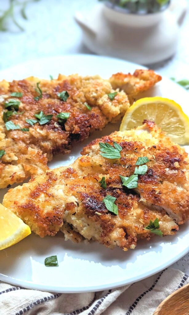 Italian chicken breast cutlets recipe with parmesan cheese seasoned breadcrumbs and lemon
