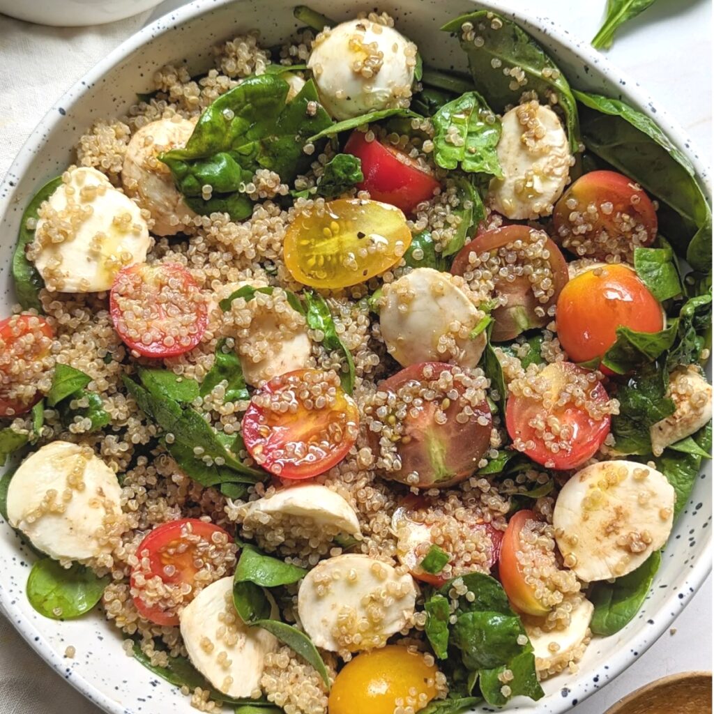 tomato basil quinoa salad recipe with spinach and balsamic vinaigrette dressing