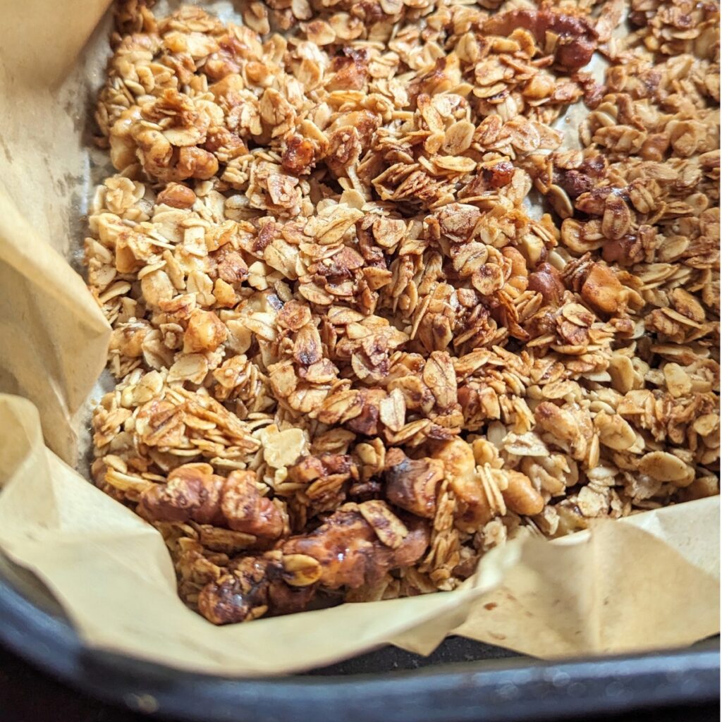 granola in the air fryer basket with parchment paper easy air fryer breakfast ideas