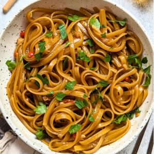 spicy honey noodles with garlic and chili peppers with cilantro and soy sauce