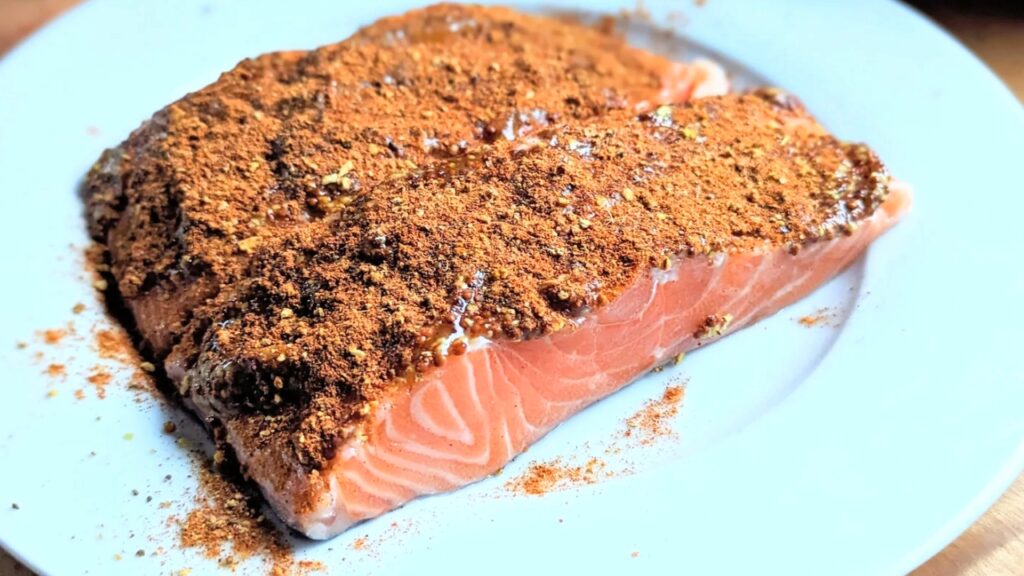 salmon with old bay seasoning recipe old bay fish on a plate with honey drizzled over the top of the salmon filets