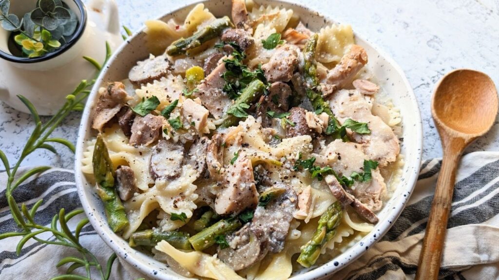spicy jamaican chicken pasta recipe with jerk seasoning and bow tie pasta with mushrooms and asparagus