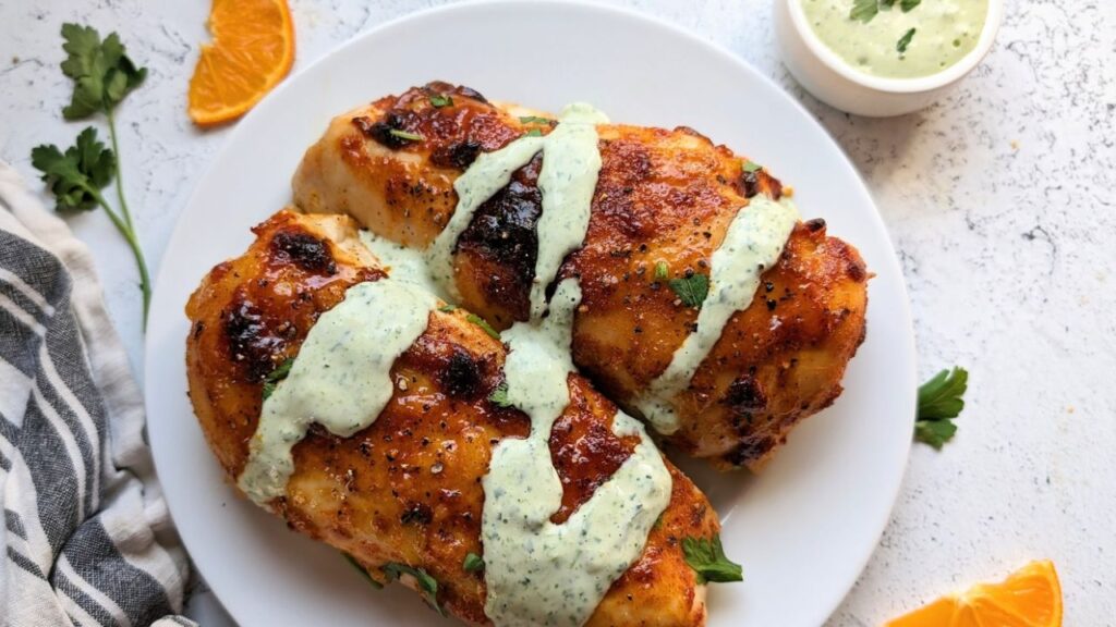 bahama breeze recipes easy sweet chicken with cilantro crema and lime juice on a plate with orange slices