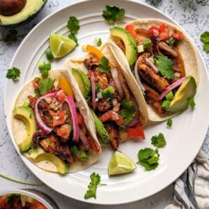 chipotle chicken fajitas copycat recipe with delicious chicken and peppers with onions and cilantro
