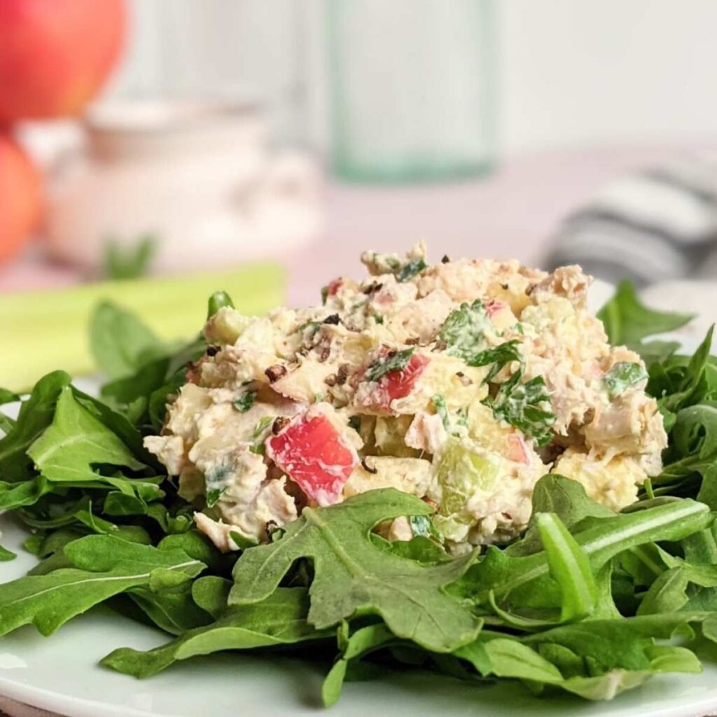 turkey salad with greek yogurt and apples over a bed of fresh salad greens.