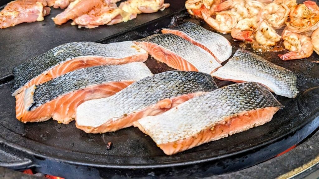 arctic char on the grill skin side up and flesh side down to char the top and the