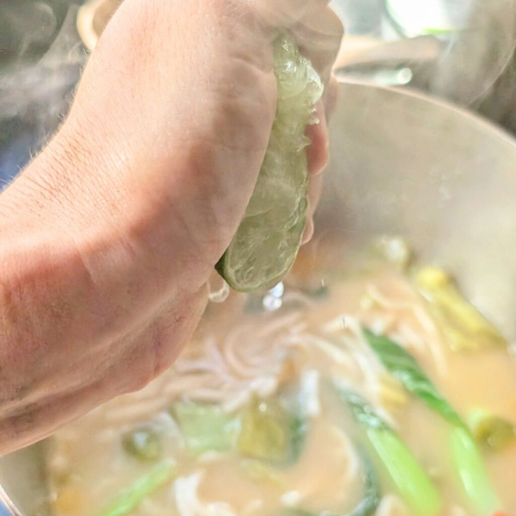 freshly squeezed lime juice in thai wheat noodle soup from trader joes noodles.