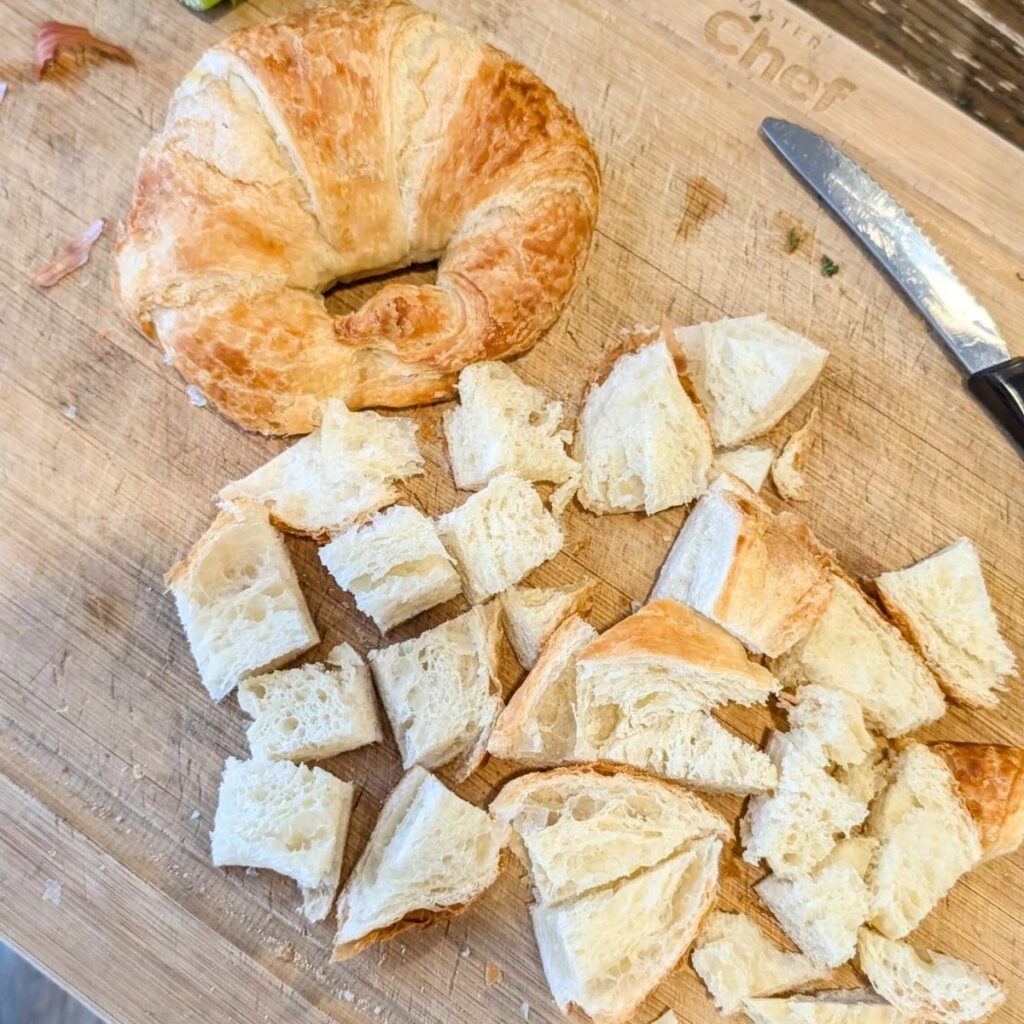 a stale croissant cubed and sliced to make croutons