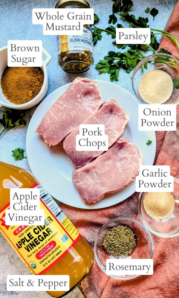 big green egg pork recipe ingredients with apple cider vinegar, parsley, mustard, and spices.