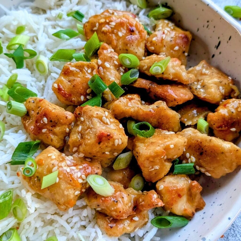 marmalade orange chicken recipe with white rice and green onions and sesame seeds