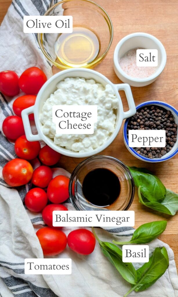 ingredients for caprese salad with cottage cheese like: tomatoes, basil, balsamic vinegar, and olive oil.
