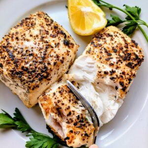 big green egg halibut recipe with spices, lemon , and fresh herbs