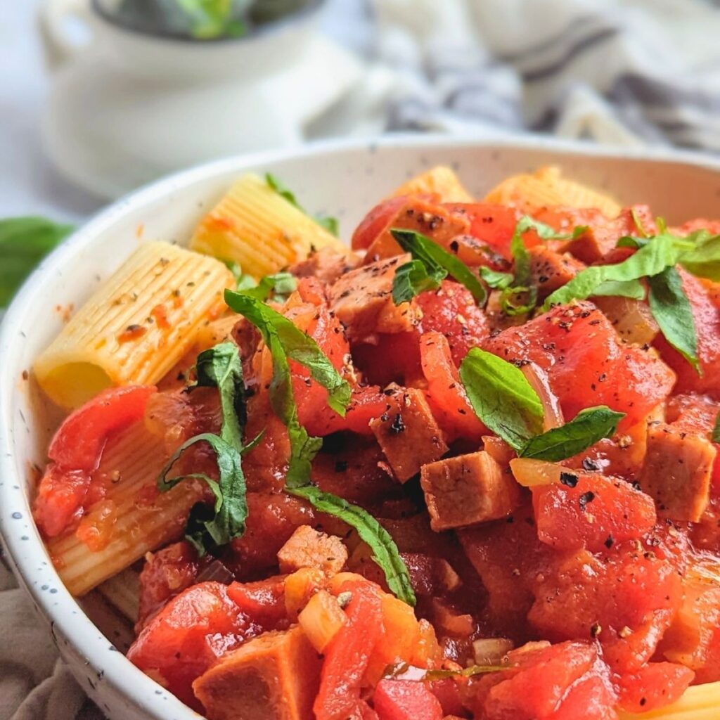 a bowl of basil and sausage pasta with spanish chorizo or Portuguese chiroco.