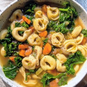 frozen tortellini soup recipe with cheese tortellini, carrots, greens, and vegetable broth.