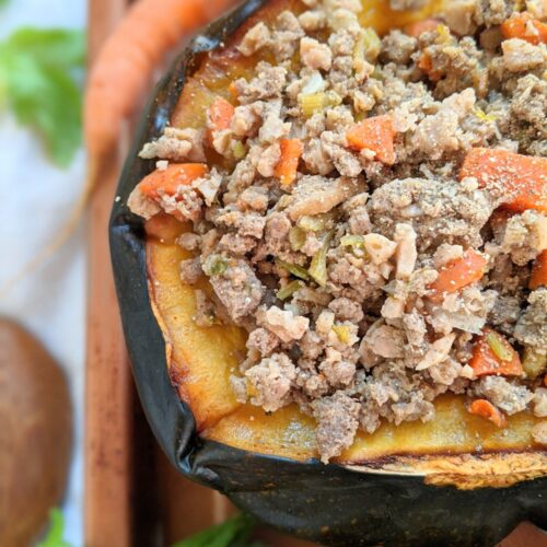 ground turkey stuffed acorn squash recipe with carrots and onions and herbs and spices.