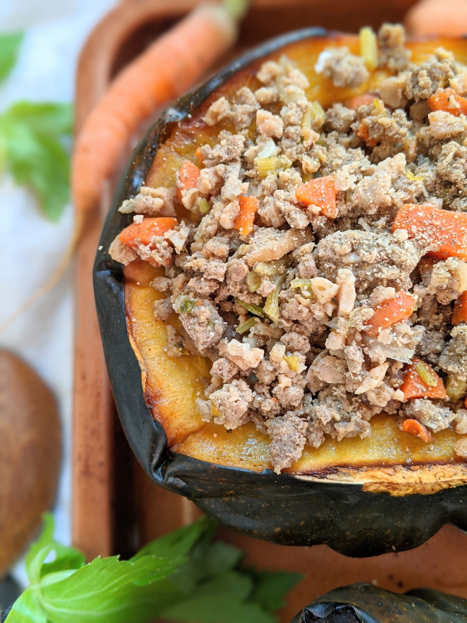 ground turkey stuffed acorn squash recipe with carrots and onions and herbs and spices.