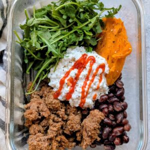 meal prep cottage cheese bowls with sweet potatoes, ground beef, arugula, and black beans