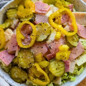 sub in a tub recipe copycat with pickles, lettuce, ham, turkey, and provolone cheese
